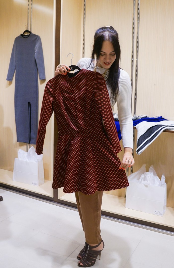 Sage (Trendy Techie) sizing up a Zafira dress from the fall collection
